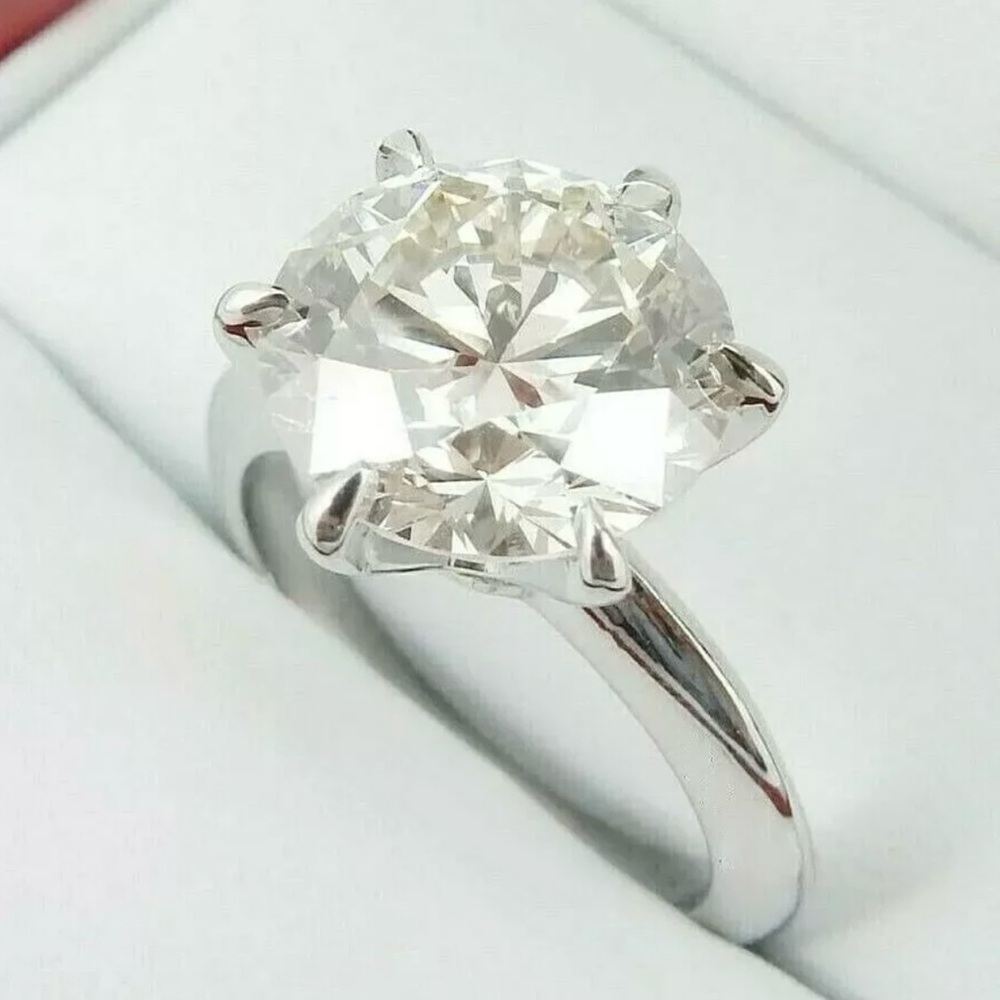 3 carat moissanite ring; 18 carat white gold over silver